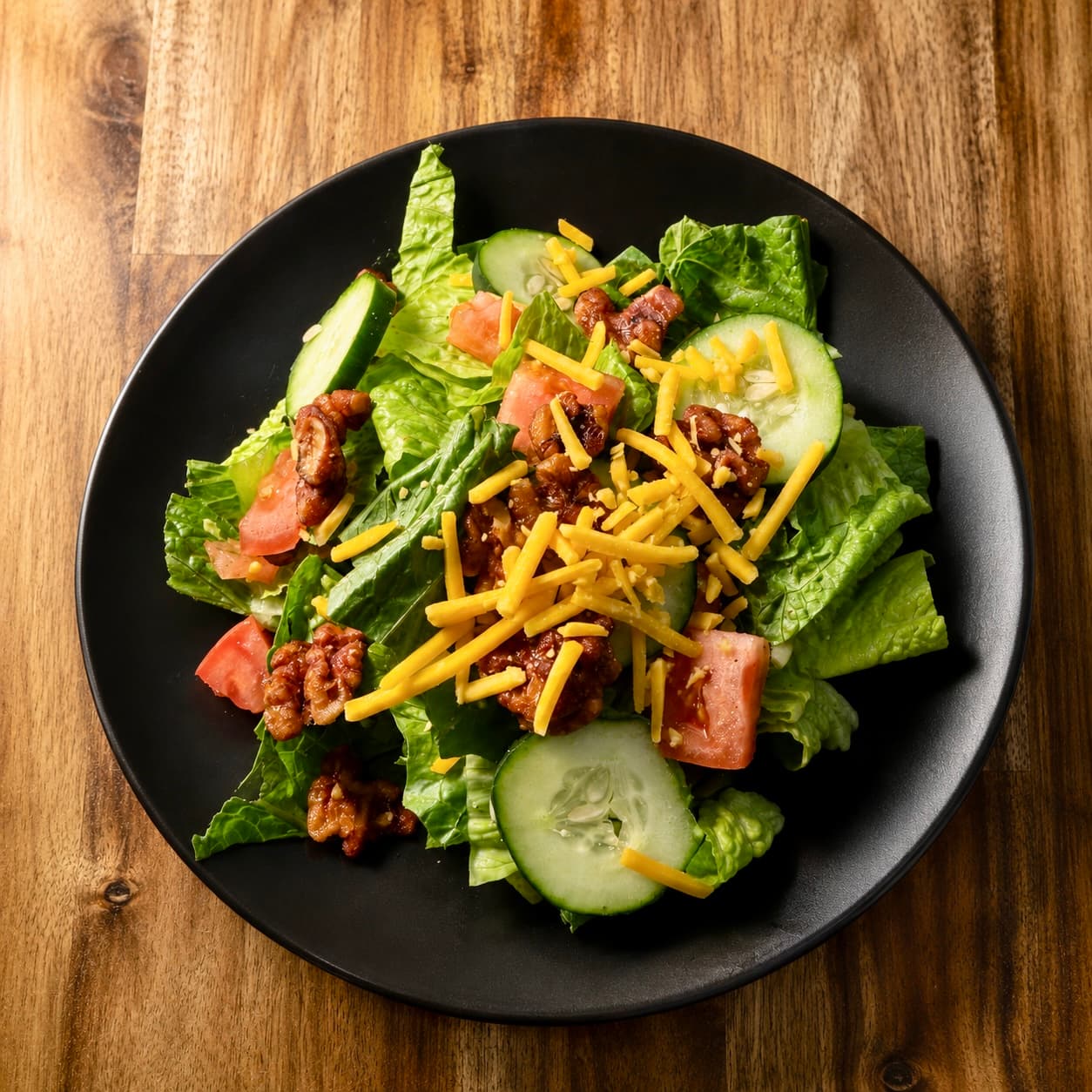 House salad with romaine, cheddar, tomato, and cucumber